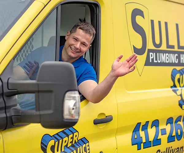 Sullivan Super Service's friendly technician in truck